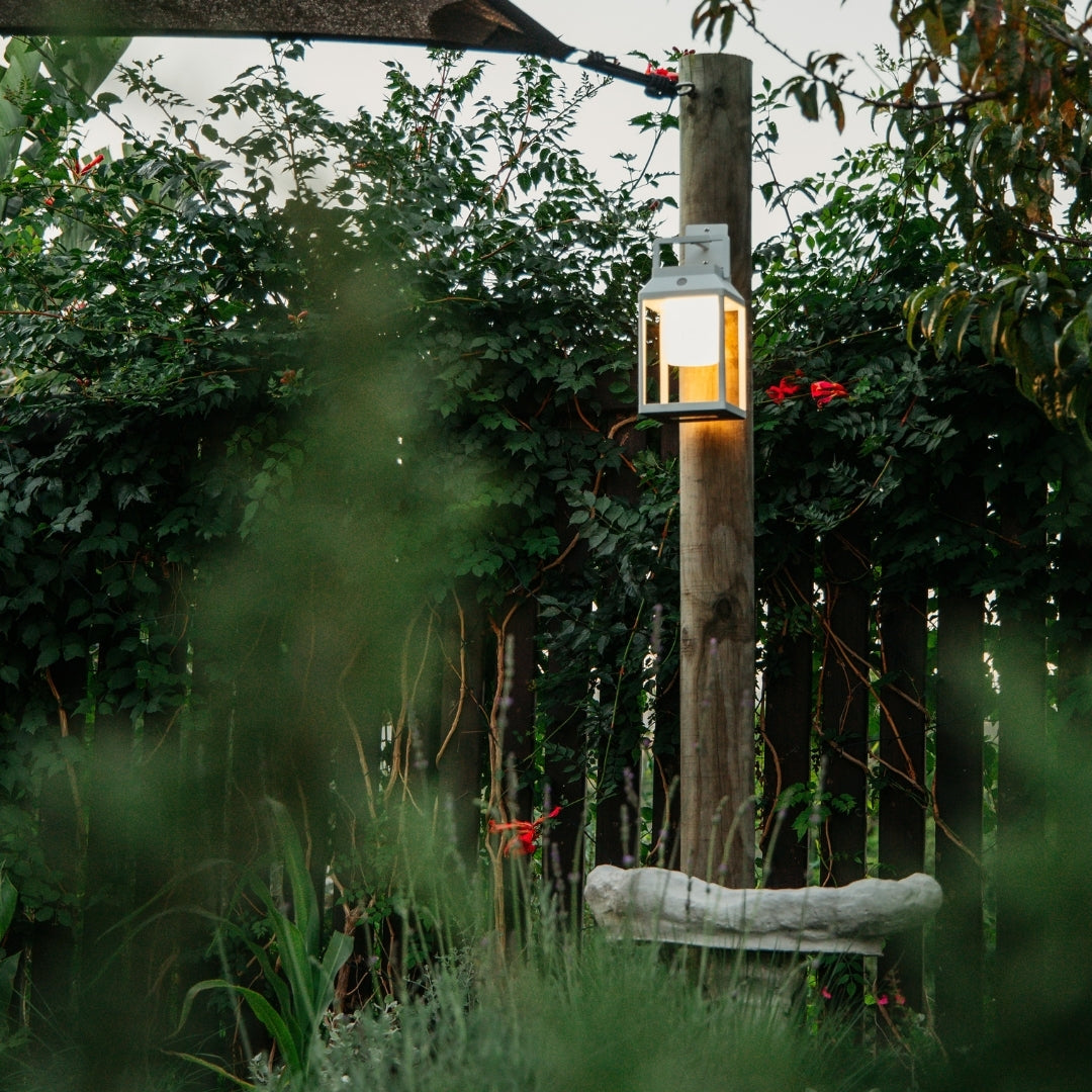 Solar Glow Lantern mounted on a pole in a garden