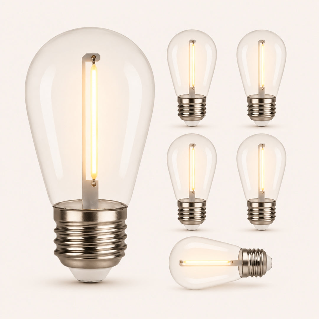 Set of clear S14 E27 light bulbs with visible filaments on a white background