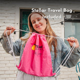 Woman holding a pink drawstring bag included with solar string lights with Stellar Lighting text, standing outdoors.