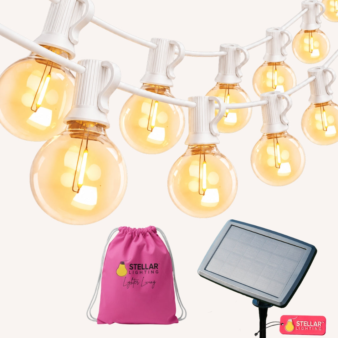 Solar string lights with 16 G40 globe bulbs on white cable shown with Stellar Lighting solar panel and pink travel bag on white background