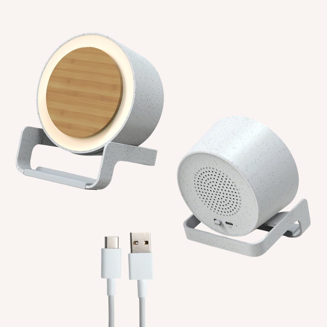 Bamboo speaker wireless charger showing front LED ring view, rear speaker grille, and included USB-A to USB-C cable