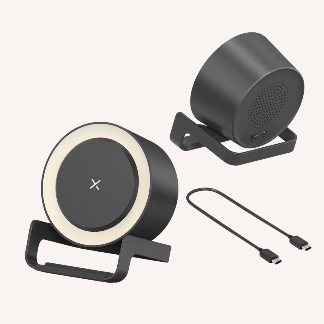 Black speaker wireless charger showing front LED ring view, rear speaker grille, and included USB-C to USB-C cable