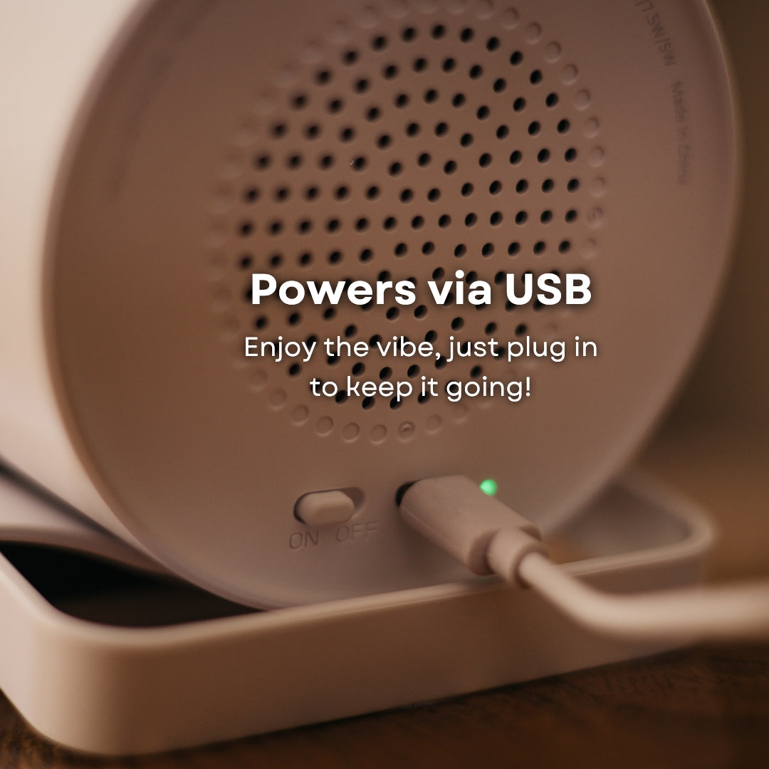 Close-up of speaker wireless charger rear grille with USB-C cable plugged in and powers via USB callout