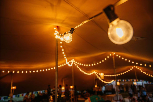 String lights hanging from a ceiling with a warm glow