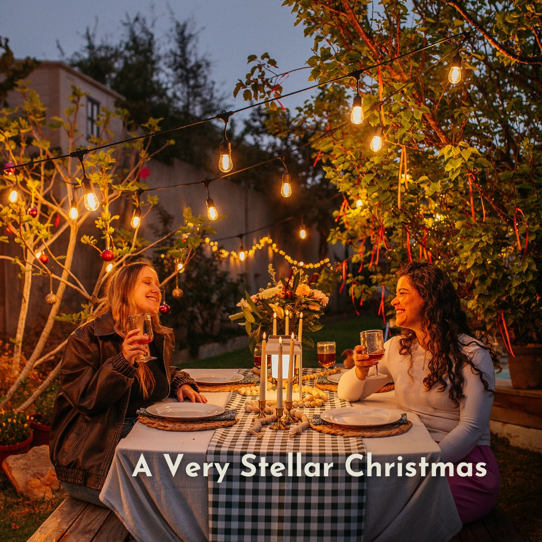 Ultimate Drop String Lights strung overhead as part of a festive outdoor Christmas setting