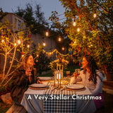 Ultimate Drop String Lights strung overhead as part of a festive outdoor Christmas setting