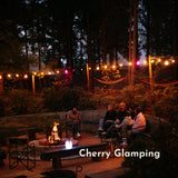 Ultimate Drop String Lights strung above an outdoor seating area at Cherry Glamping