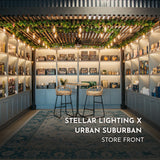 Ultimate Gold Drop String Lights with warm golden T45 tubular bulbs suspended on individual drop wires strung across a South African pergola creating a dramatic considered lighting installation in the Stellar Lighting and Urban Suburban shop.