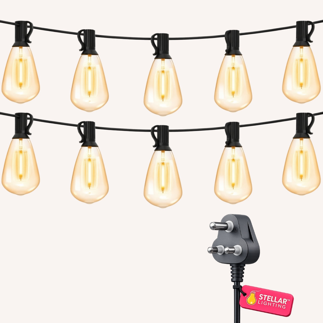 Vintage string lights with 25 ST38 Edison bulbs on black cable with South African 3-pin plug on white background