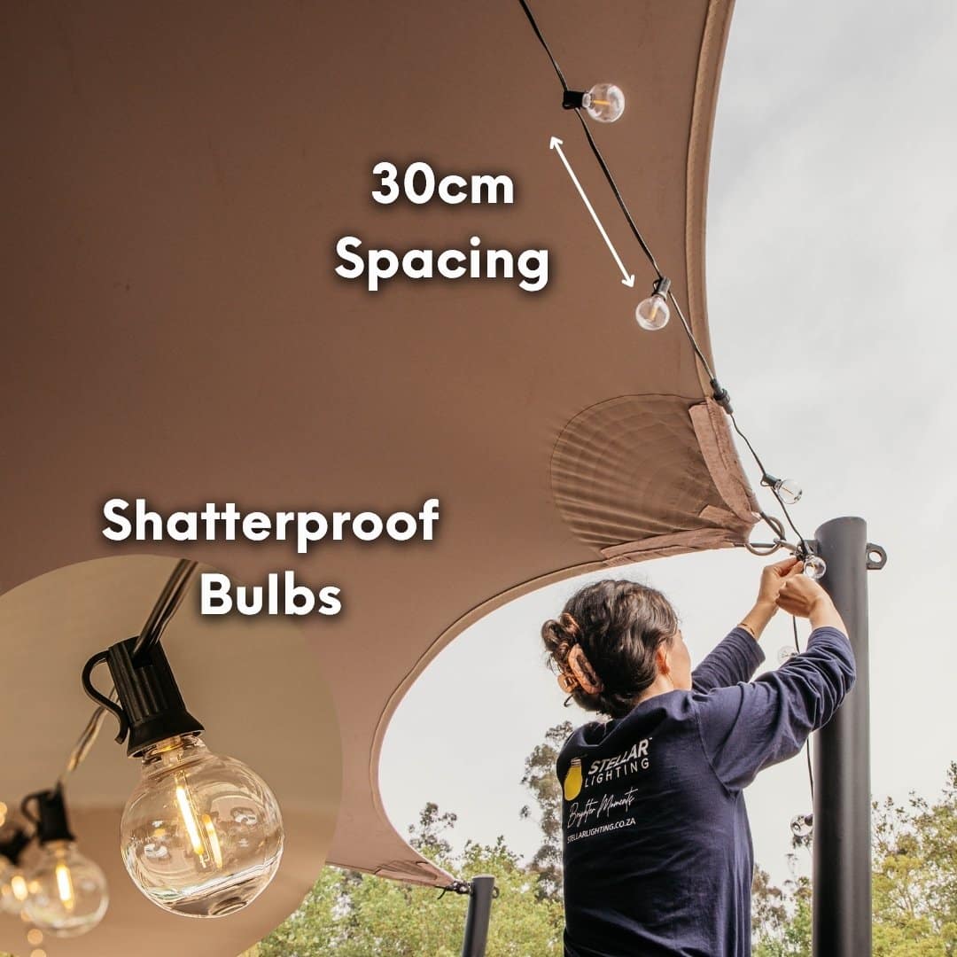 Outdoor black string lights with 25 warm LED bulbs creating a soft glow over a patio at night