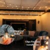 Outdoor black string lights with 25 warm LED bulbs creating a soft glow over a patio at night