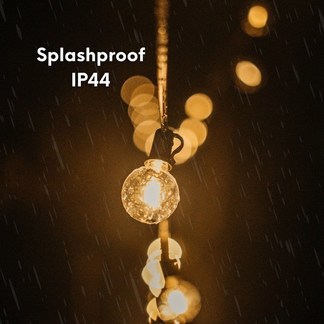 Outdoor black string lights with 25 warm LED bulbs creating a soft glow over a patio at night