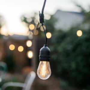 Stellar Lighting Drop String Lights with 10 warm white S14 bulbs on a black cable, 10 metres in length