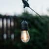Stellar Lighting Drop String Lights with warm white S14 bulbs on a black cable, 10 metres in length