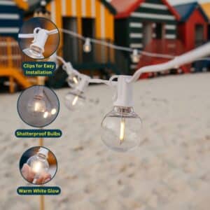 Solar string lights with 16 warm white LED bulbs and white cable.