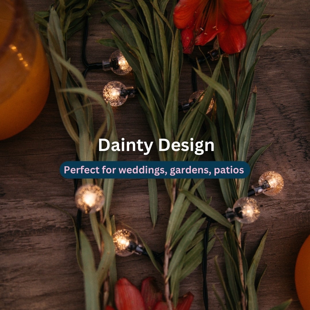 50 LED Solar Bubble Ball Fairy Lights glowing in an outdoor garden setting