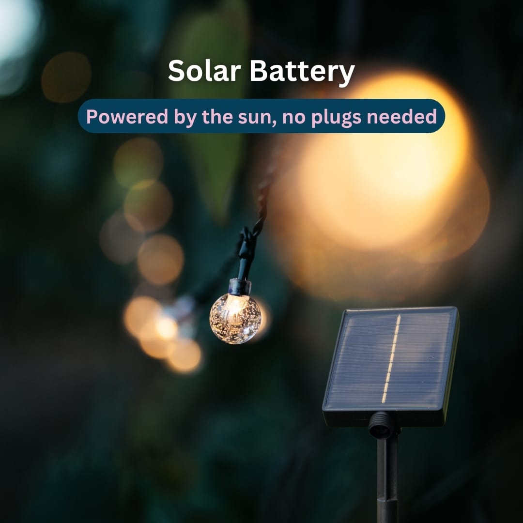 50 LED Solar Bubble Ball Fairy Lights glowing in an outdoor garden setting