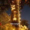 20m Solar Fairy Lights glowing in a garden setting