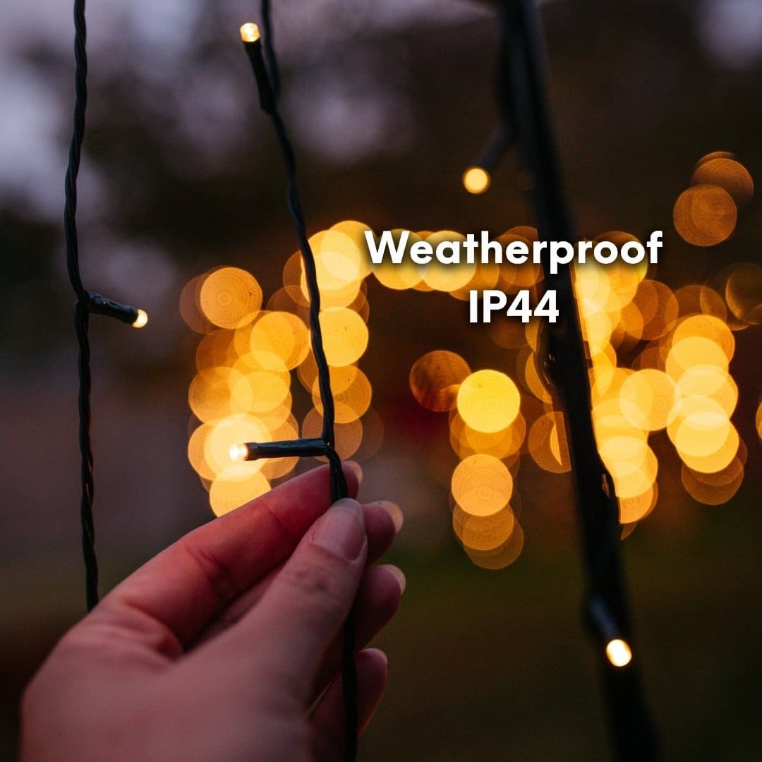 20m Solar Fairy Lights glowing in a garden setting