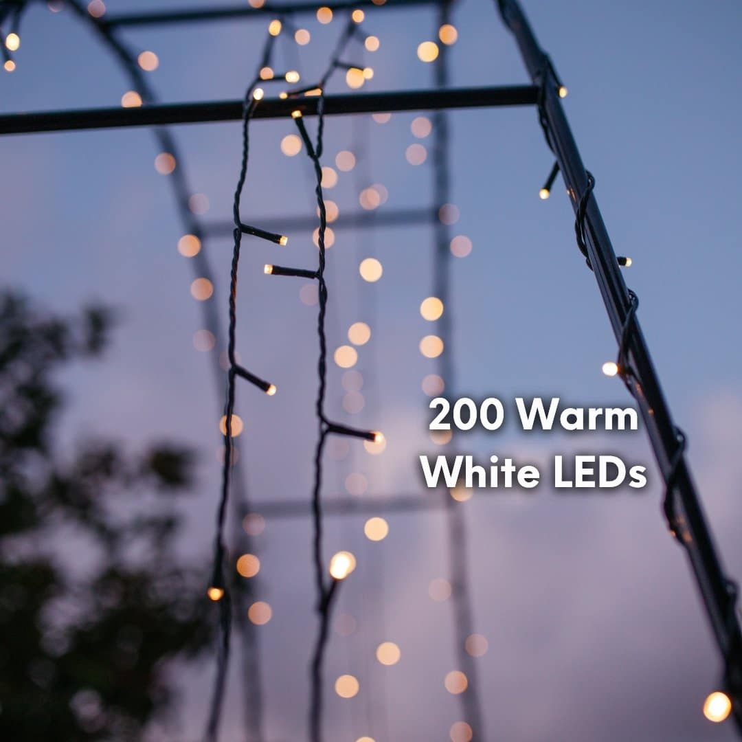 20m Solar Fairy Lights glowing in a garden setting