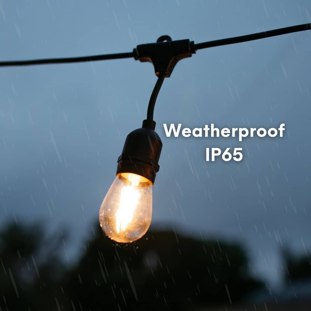 IP65 waterproof 10m festoon string lights by Stellar Lighting glowing over a patio dining setup in South Africa.