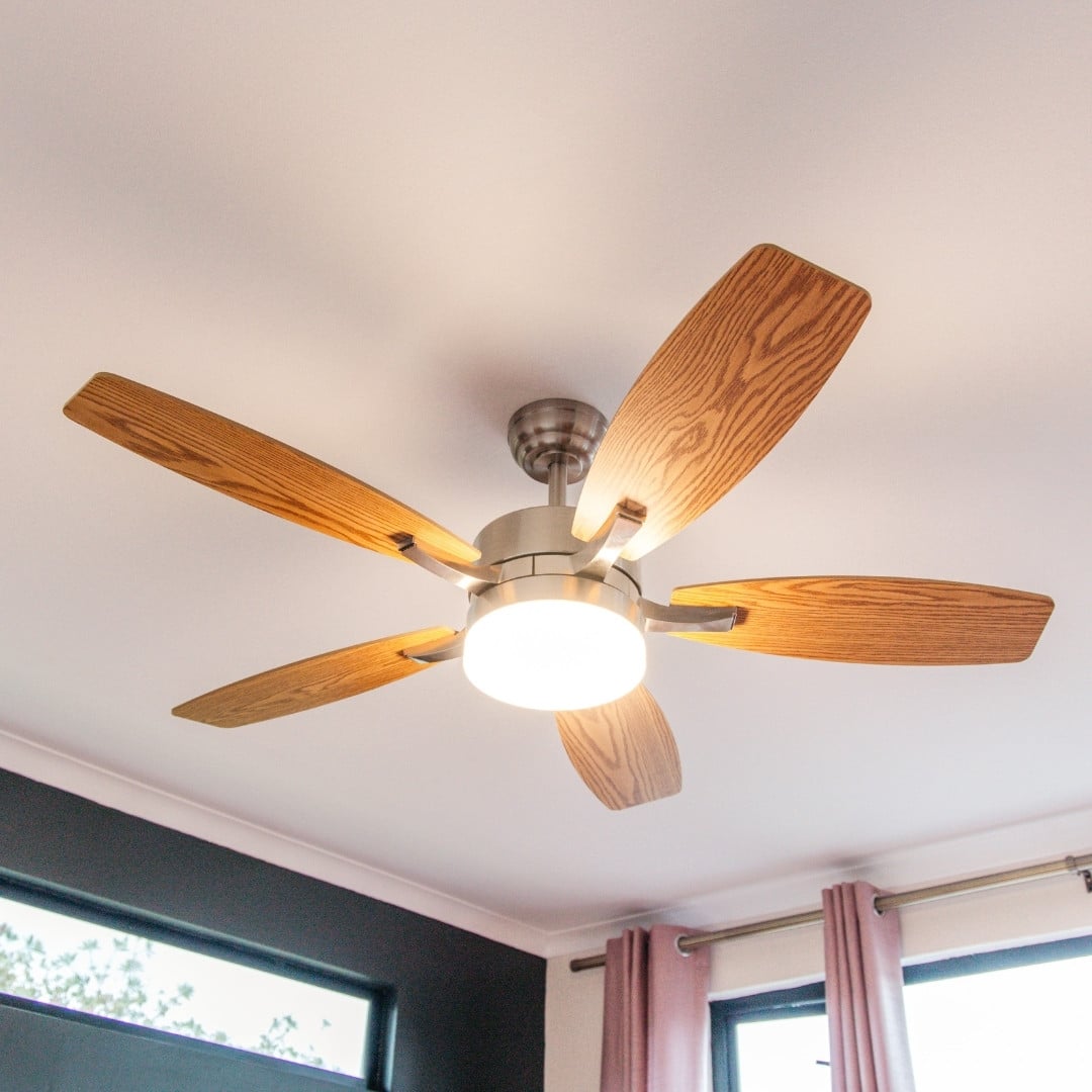 52-inch ceiling fan with light and remote control, featuring brown oak blades.