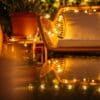 Romantic solar fairy lights, bubble lights, and flickering tea lights glowing under a tree.