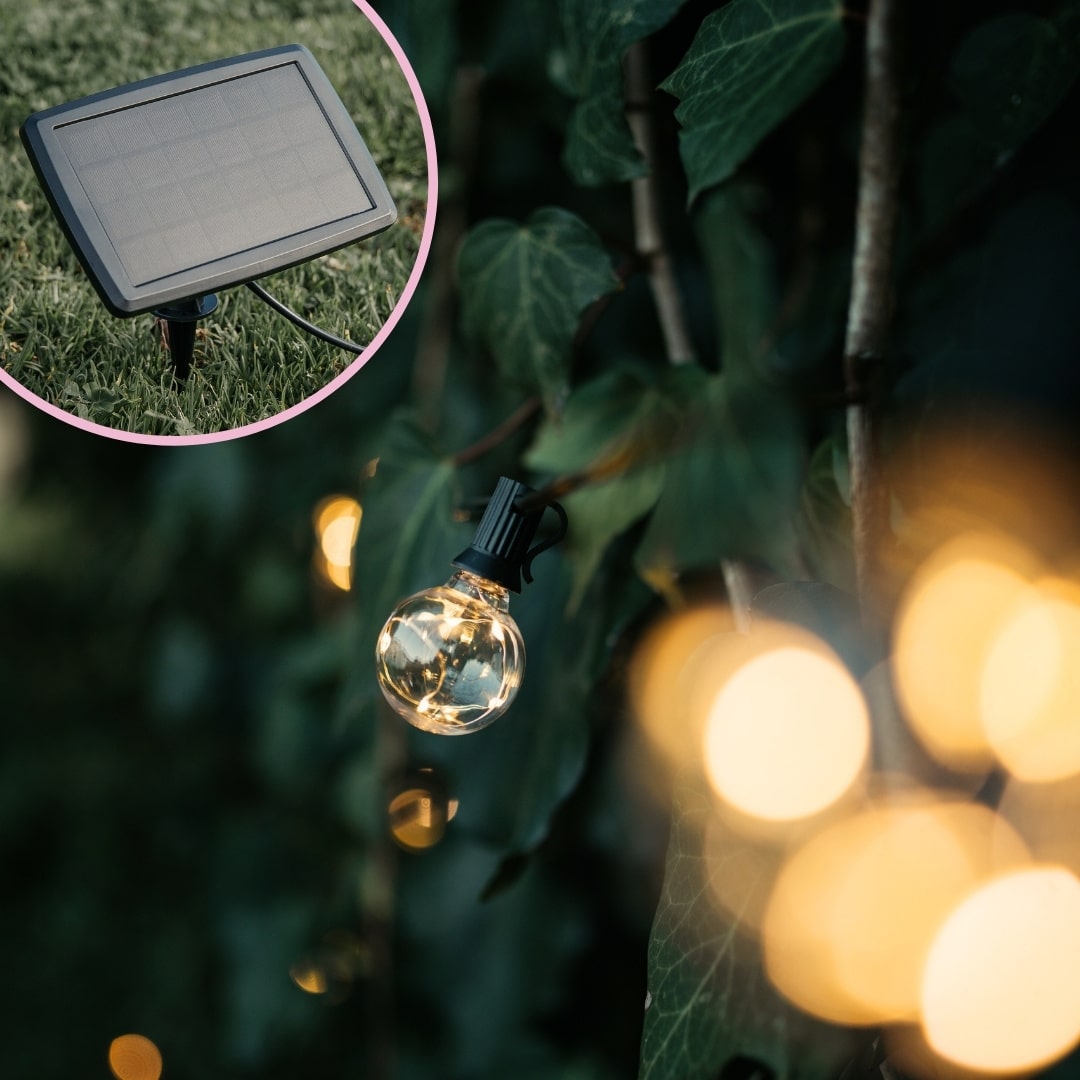 Romantic solar fairy lights, bubble lights, and flickering tea lights glowing under a tree.