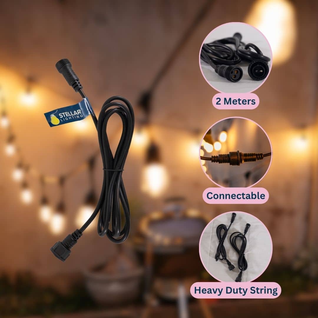 Outdoor string lights and speaker lantern illuminating a braai area at dusk.