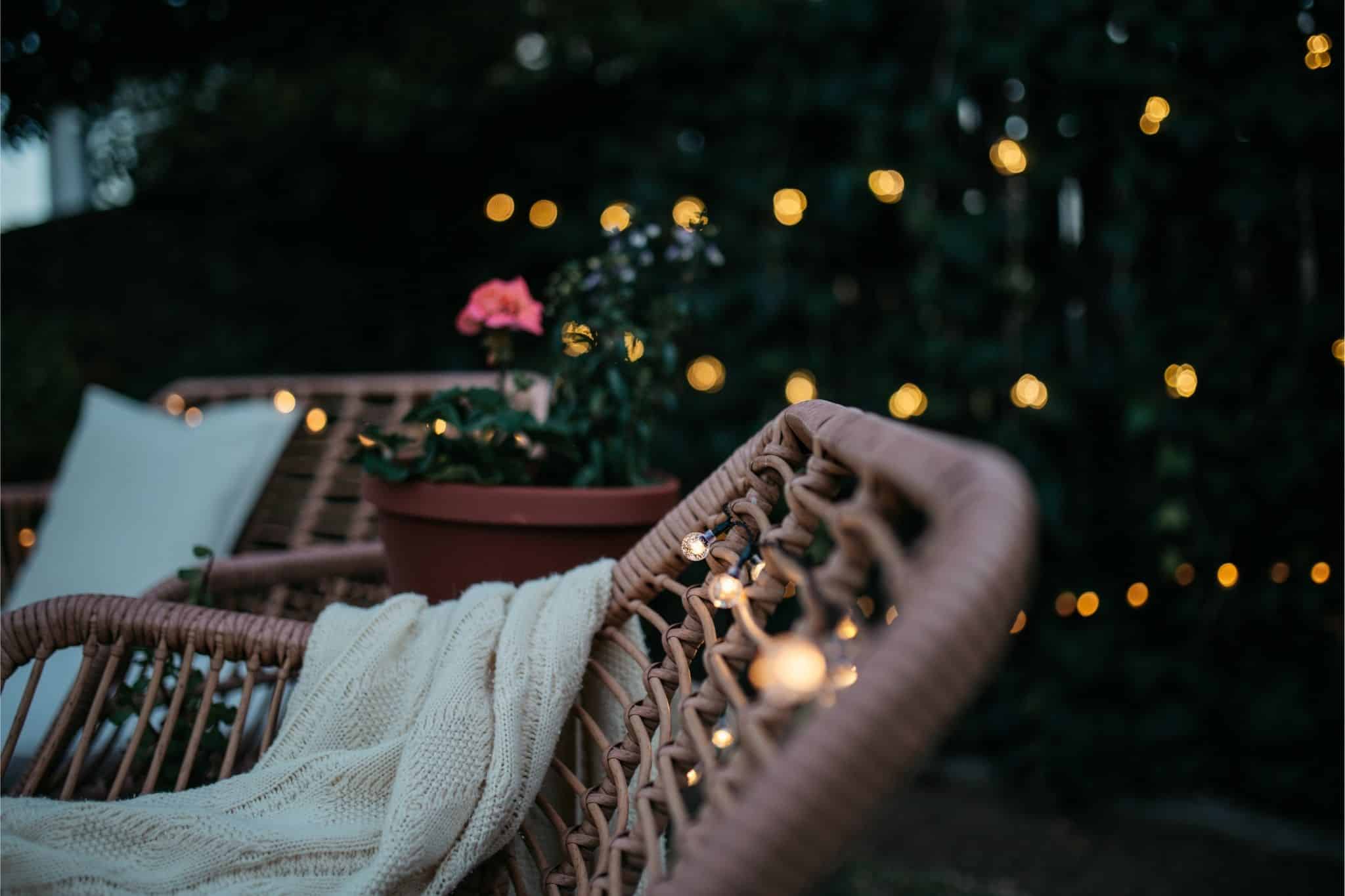 Romantic solar fairy lights, bubble lights, and flickering tea lights glowing under a tree.