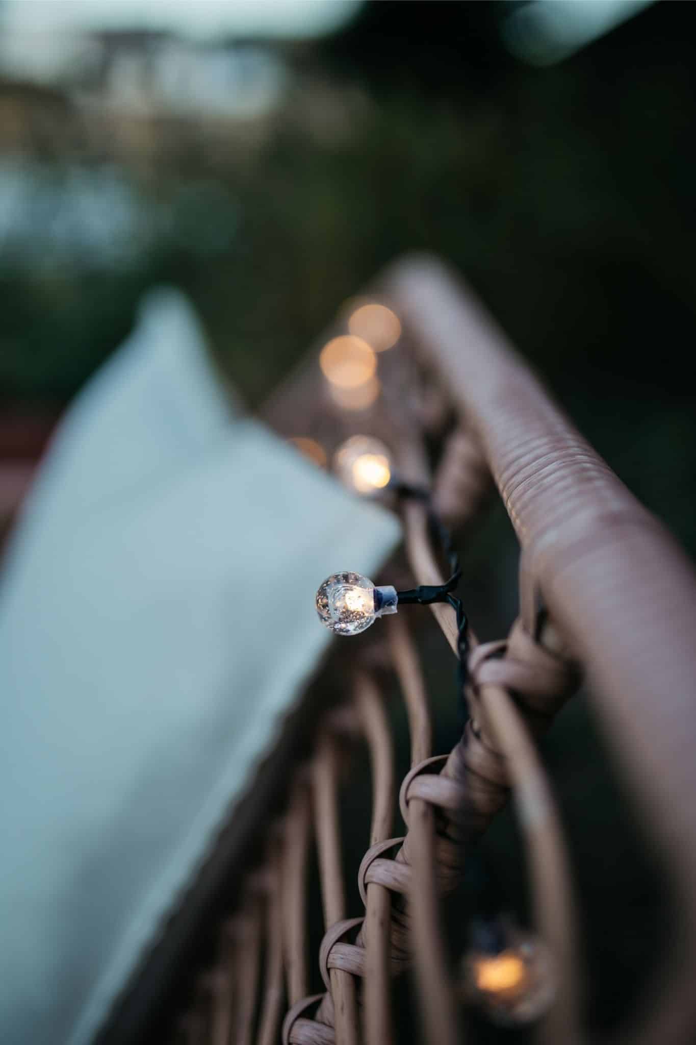 Romantic solar fairy lights, bubble lights, and flickering tea lights glowing under a tree.