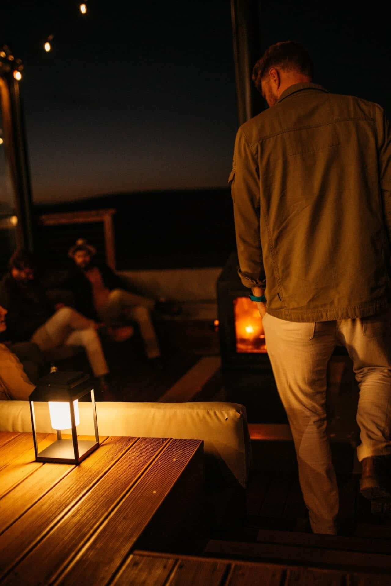 Black Solar Glow Lantern – Weatherproof Outdoor Light Black solar LED lantern mounted on outdoor wall with soft glow