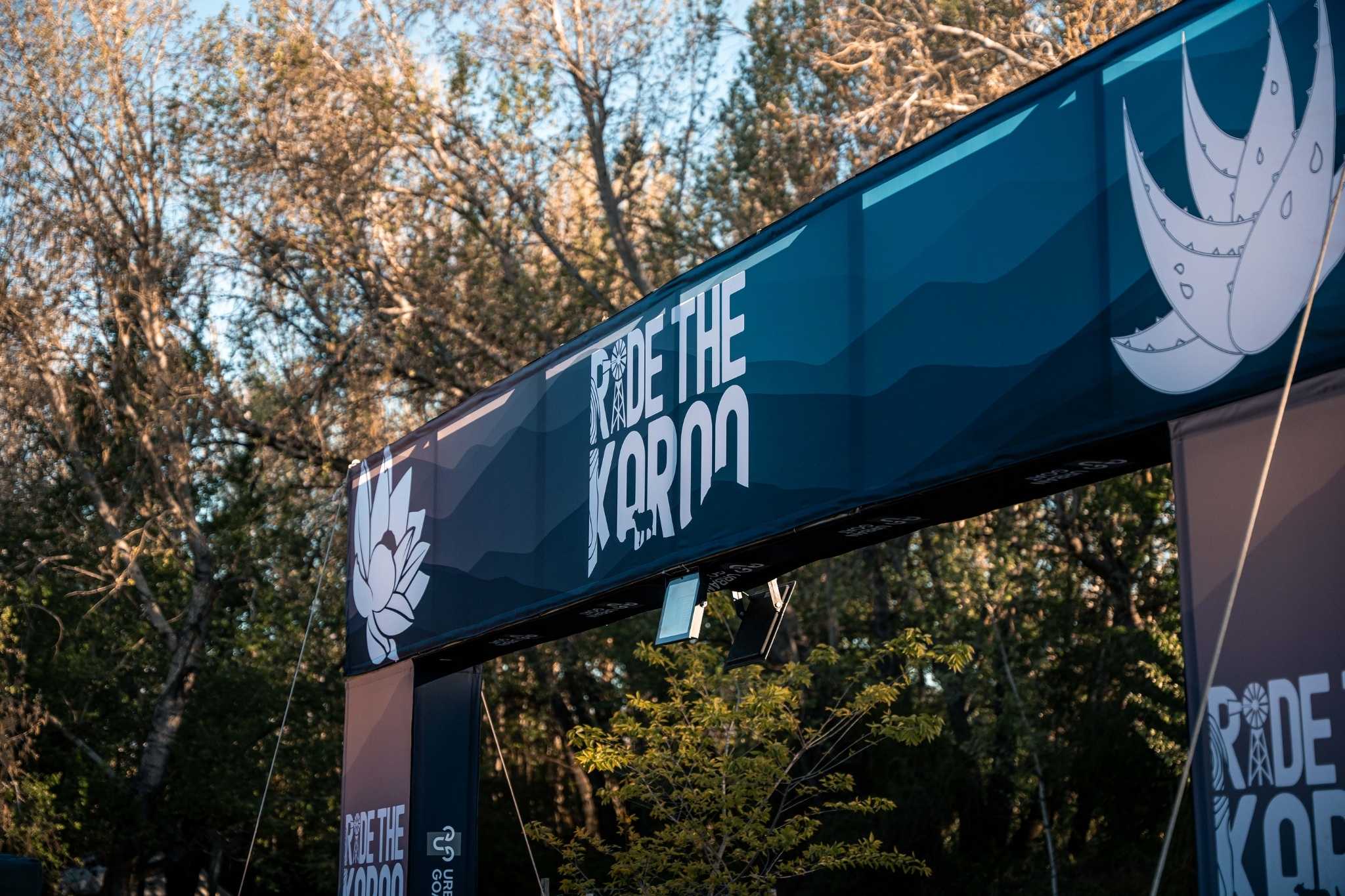 Cyclists stopping at a water point during Ride the Karoo