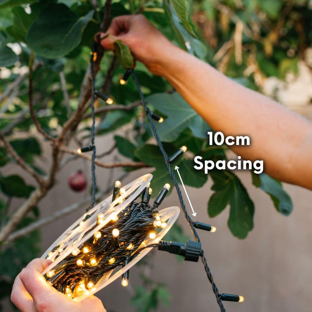 10 m heavy-duty fairy light string with 100 warm white LEDs and 3 m extension lead.