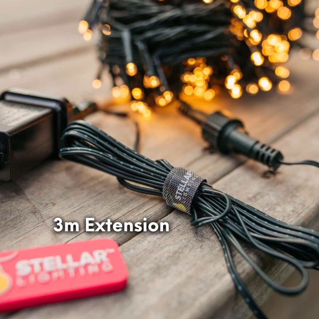 30m warm white heavy duty fairy lights creating a soft outdoor glow in a garden setting.