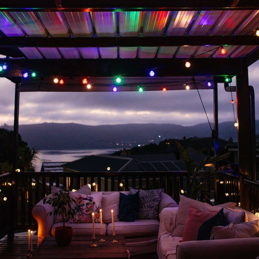 G40 multicolour Christmas bulb close-up on black classic cable