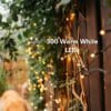 Close up of the 30m heavy duty warm white fairy lights showing the thick dark green cable and dense LED spacing.
