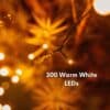 30m warm white heavy duty fairy lights creating a soft outdoor glow in a garden setting.