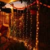 Curtain String Lights - Warm White LED Fairy Lights draped over curtain, creating a cozy atmosphere.