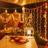 Curtain String Lights - Warm White LED Fairy Lights draped over curtain, creating a cozy atmosphere.