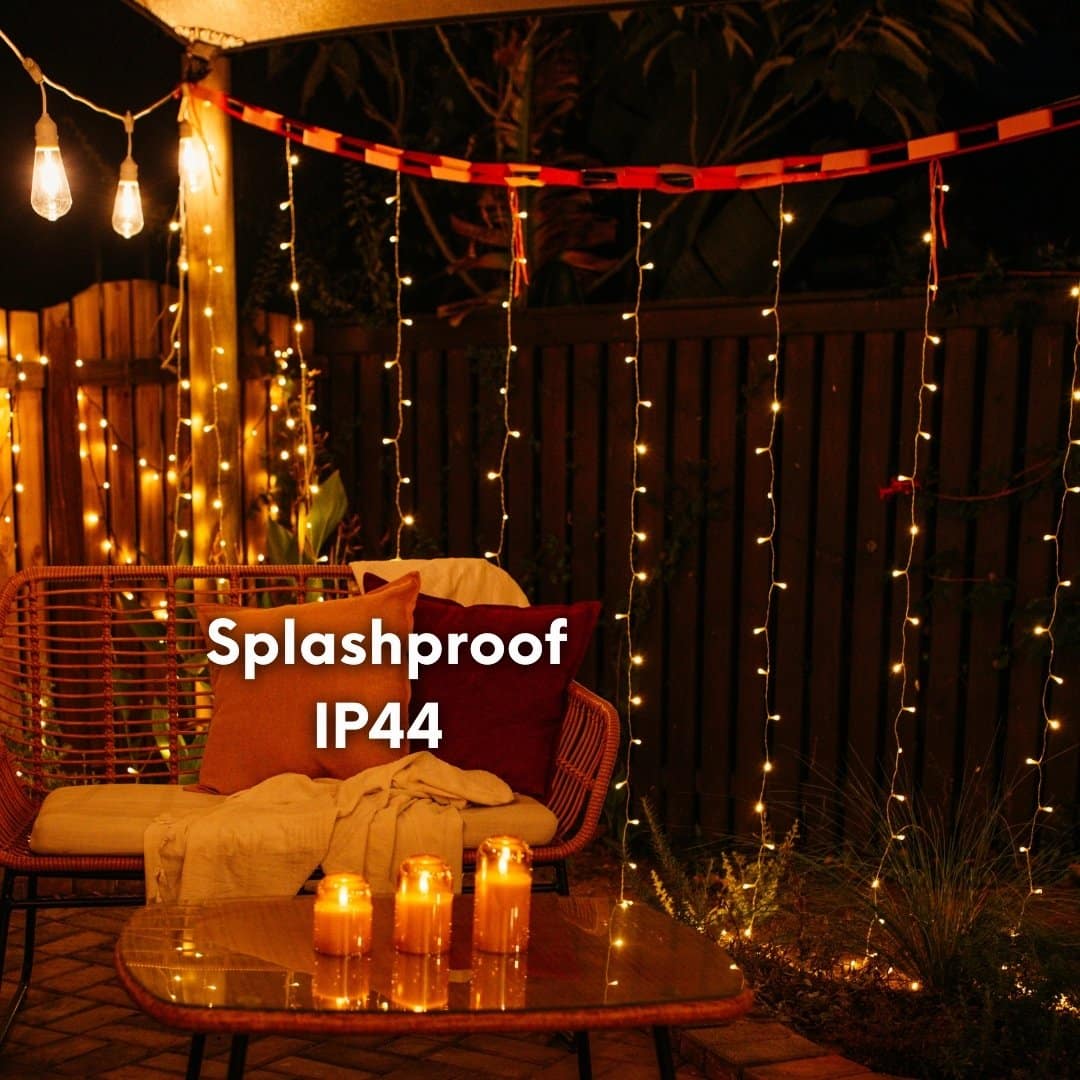 Curtain String Lights - Warm White LED Fairy Lights draped over curtain, creating a cozy atmosphere.