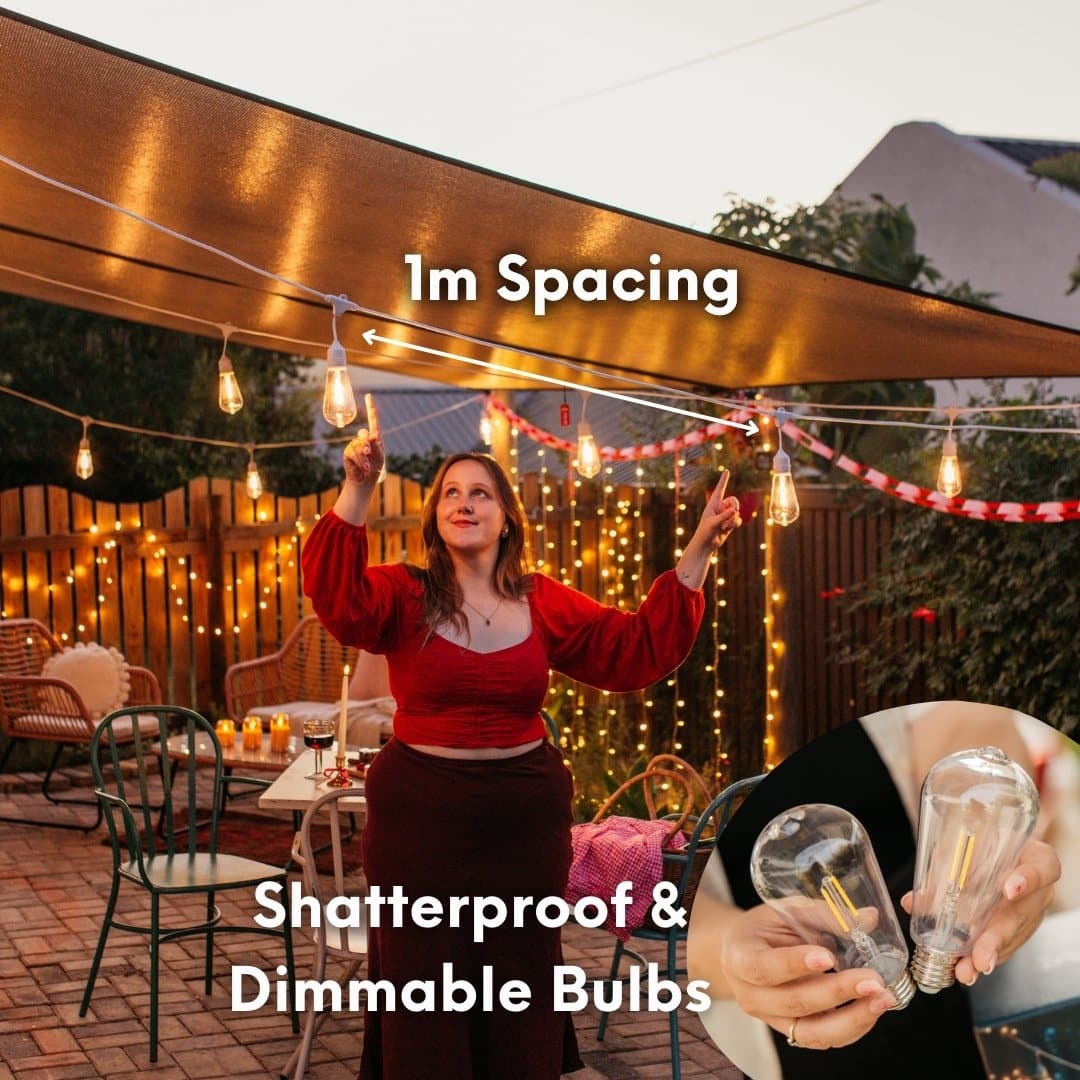 10m white festoon string lights with warm ST64 LED bulbs glowing outdoors