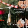10m white festoon string lights with warm ST64 LED bulbs glowing outdoors