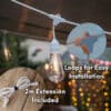 10m white festoon string lights with warm ST64 LED bulbs glowing outdoors