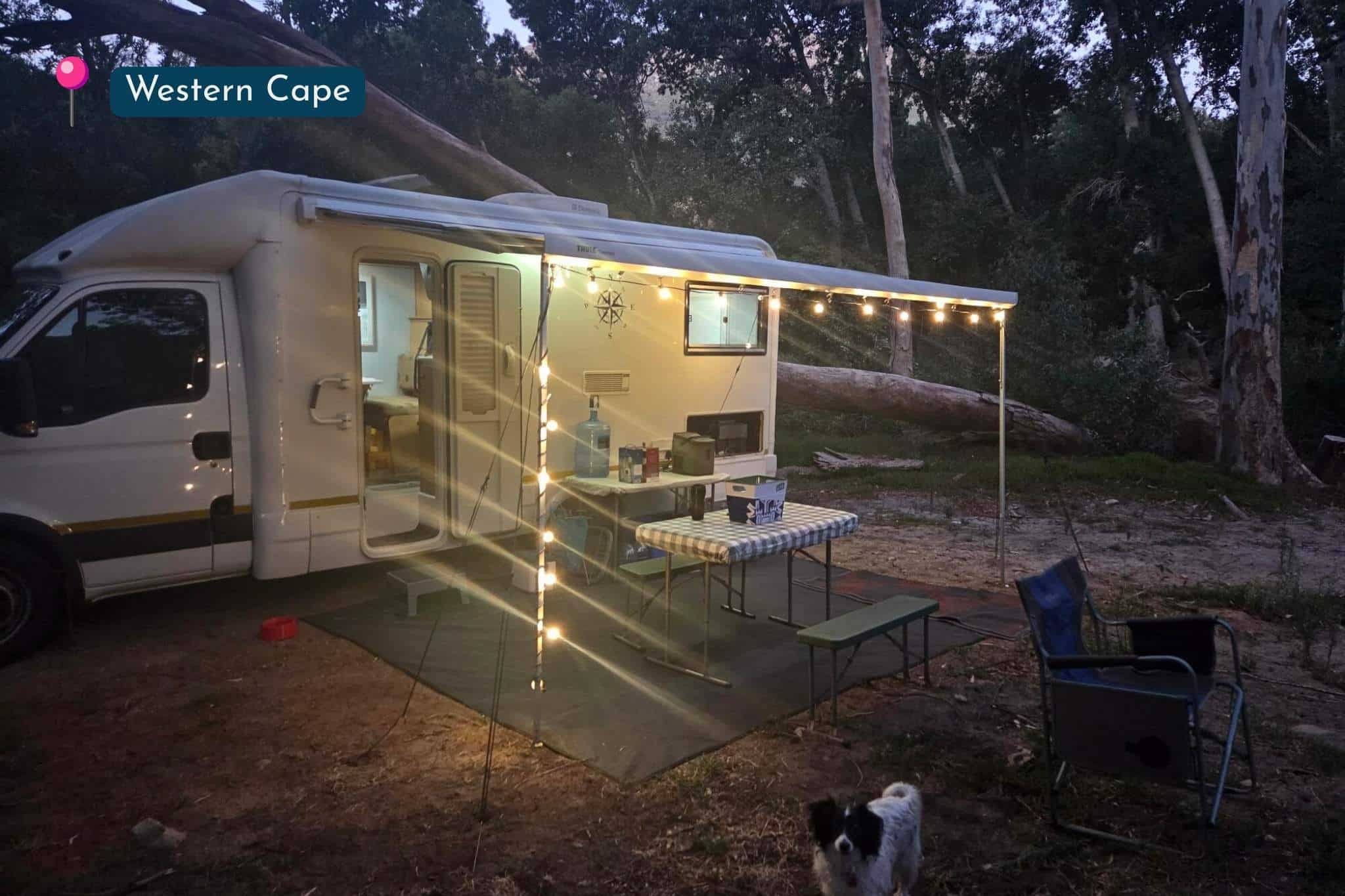 Caravan campsite in the Western Cape lit with warm classic string lights at night