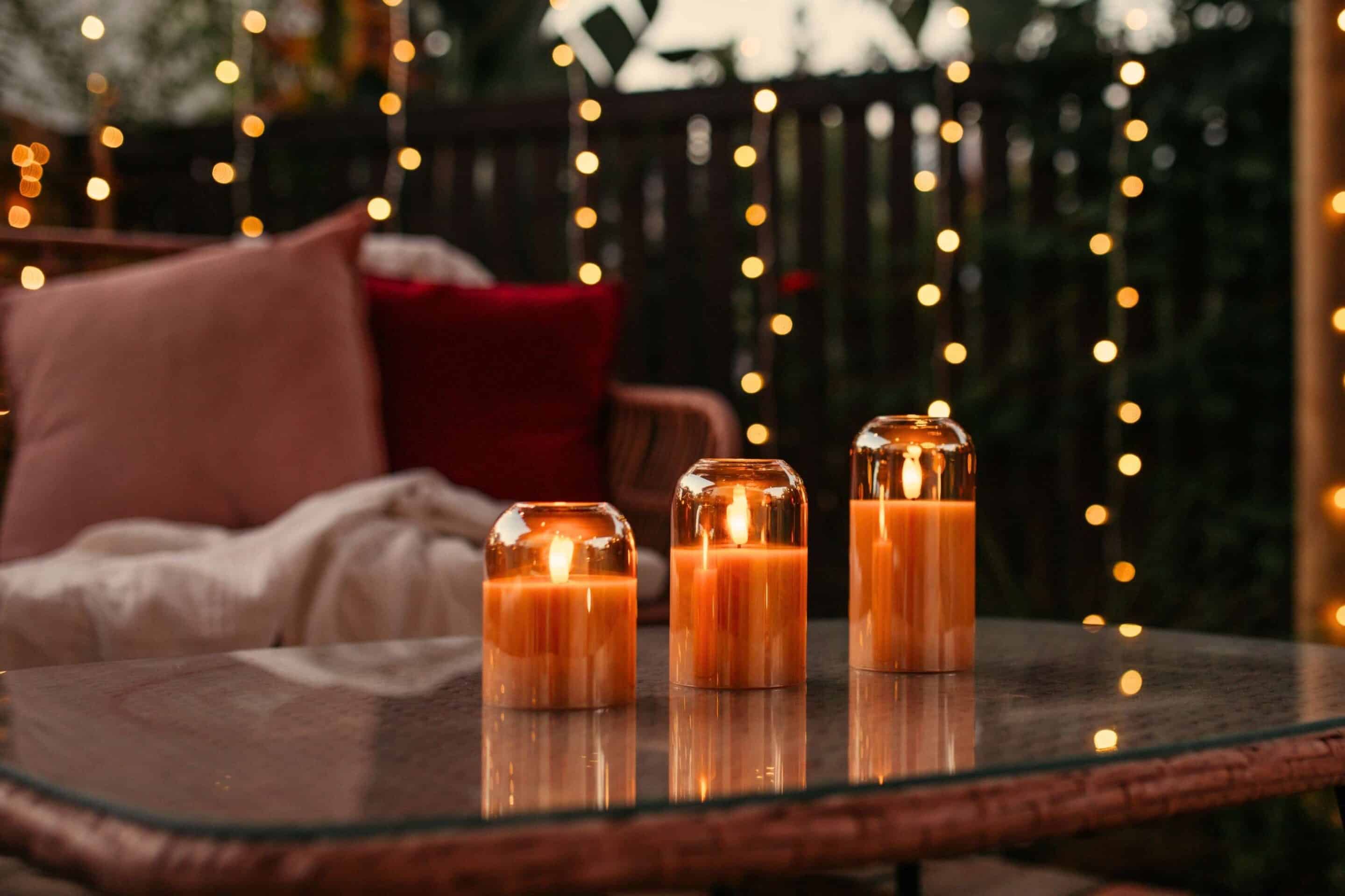 Romantic outdoor Valentine’s Day lighting with festoon lights, lanterns, and candles
